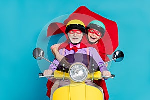 Photo of retired pensioner grey haired couple wife husband people wear helmet mask ride biker isolated on blue color