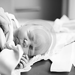 Photo in retro style.Sleeping newborn resting in bed.