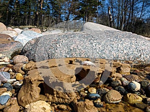 Photo with rocks and sand texture on the seashore