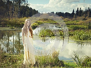 Photo of romantic woman in fairy forest