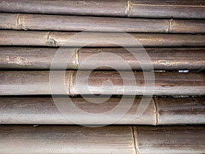 photo of a row of horizontal bamboo sticks for background