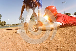 Photo of Runner and Infielder Both Reaching Base