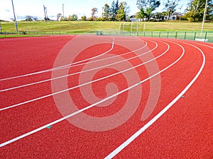 Photo of running track slot drain along radius, adjacent to steeplechase.