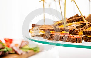 Sandwiches with cheese and vegetables of triangular shape