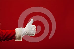 Photo of Santa Claus gloved hand in pointing