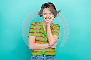 Photo of satisfied glad person toothy smile arm touch cheekbone isolated on cyan color background