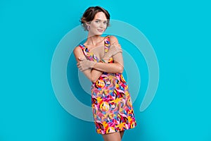 Photo of satisfied pretty good mood woman with bob hair dressed colorful clothes embrace herself isolated on blue color