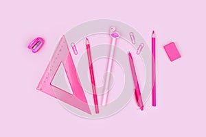 Photo of school supplies on pink background