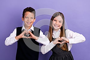 Photo of schoolkids in classroom make heart sign love school isolated on bright color background