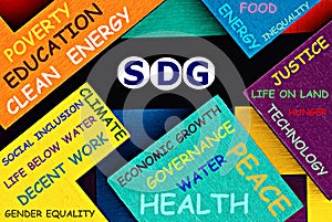 Photo on SDG Sustainable Development Goals theme. The acronym  `SDG` on a colorful background. Sustainable development concept