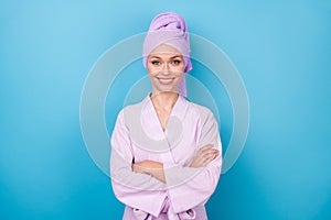 Photo of self-assured cute lady crossed hands white smile wear purple towel turban bath robe isolated blue color