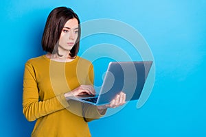 Photo of serious confident woman communicating instagram twitter telegram facebook empty space isolated blue color