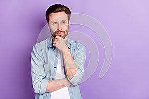 Photo of serious thoughtful minded suspicious man look copyspace thinking isolated on purple color background