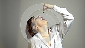 Photo session grimacing woman with jewelry