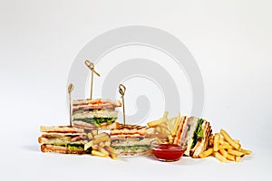 Photo session new menu of coffee house, fresh club sandwich with chicken and vegetables, lettuce salad, french fries, ketchup