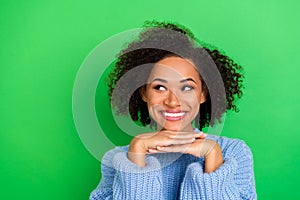 Photo of shiny pretty cute beaming woman with wavy hairstyle dressed blue sweater looking at empty space isolated on