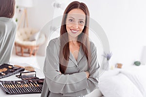 Photo of shiny sweet lady grey sleepwear applying make up arms folded indoors home bedroom