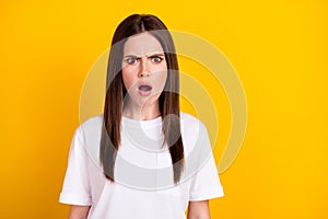 Photo of shocked amazed crazy scared afraid woman hear unexpected news information isolated on yellow color background