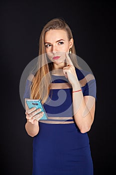 Photo shoot beautiful blonde woman in navy blue dress