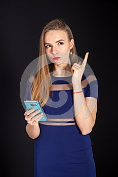 Photo shoot beautiful blonde woman in navy blue dress