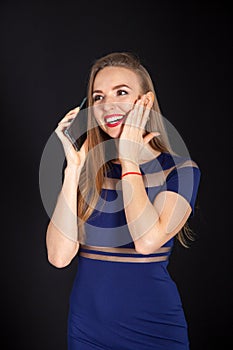 Photo shoot beautiful blonde woman in navy blue dress