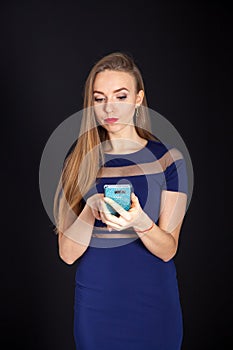 Photo shoot beautiful blonde woman in navy blue dress