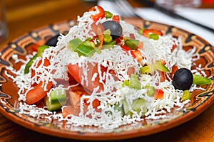 Photo of Shopska salad. Traditional Bulgarian cuisine.