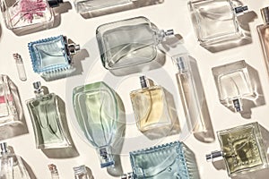 This photo showcases a top-down view of numerous transparent glass perfume bottles, creating a visually appealing and