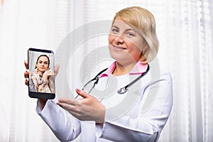 Photo showing Online Doctor working at laptop in medical office. Distance job. Business photo, modern healthcare practitioners,