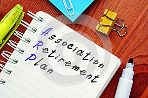 The photo shows Association Retirement Plan. Notepad, marker