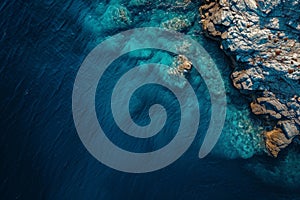 This photo shows a birds eye view of a large body of water with surrounding land formations and natural features, Overhead image