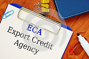 The photo shows Export Credit Agency ECA. Notepad, heap, marker photo
