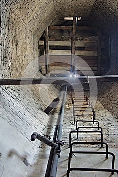 The interior of an old, historic, brick water tower .