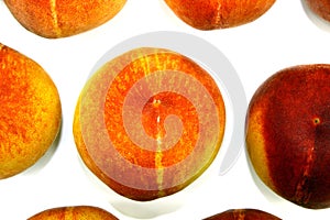 Juicy peaches photographed from above on a white background