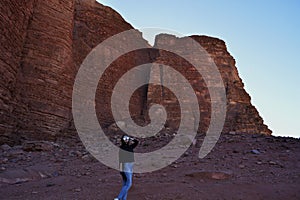 Girl at the sunset in the Wadi Rum desert in Jordan