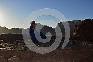 Girl at the sunset in the Wadi Rum desert in Jordan