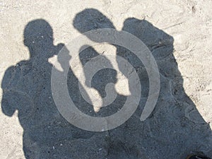 The shadows on the sand of the Black Sea shore photo