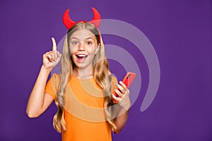 Photo of small lady horns headband holding telephone raise finger have idea for new social network post demon theme wear