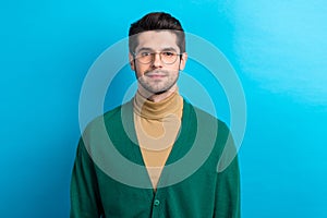 Photo of smiling happy man wear green cardigan spectacles smiling isolated blue color background