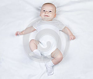 Photo of smiling three-month child