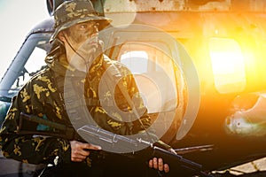 Photo of a soldier with an automatic rifle