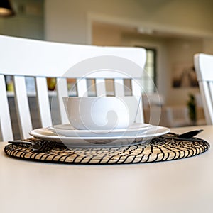 Photo Square Table setting on family dining table with white tableware and round placemat
