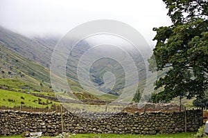 Photo of Stone fence across a field