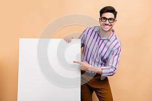 Photo of strategy marketing specialist man pointing finger empty space mockup banner brand advertisement isolated on