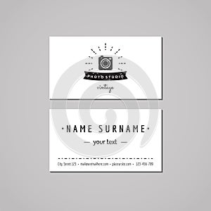 Photo studio business card design concept. Photo studio logo with photo camera, rays and ribbon. Vintage, hipster and retro style