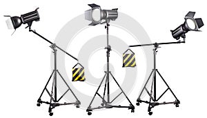 Photo studio lighting stands with flash and softbox isolated on the white