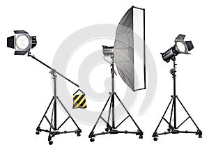 Photo studio lighting stands with flash and softbox isolated on the white