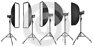 Photo studio lighting stands with flash and softbox isolated on the white