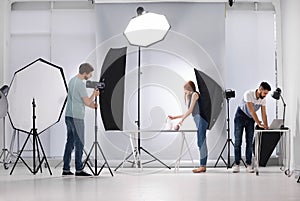 Photo studio with professional equipment and workers