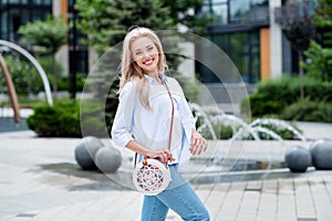 Photo of stunning adorable positive woman going shopping store mall center nice weekend pastime outdoors photo